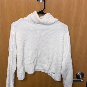 white turtleneck cropped sweater.